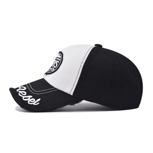 Close-up of rebel embroidery and frayed edge detail on a two-tone cotton baseball cap