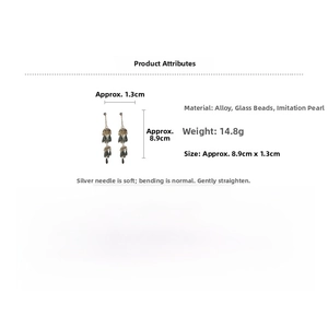 Detail view of pearl tassel earrings with dimensions 8.9cm by 1.3cm and material specs