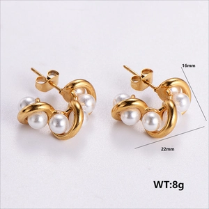 Detail showing 22mm golden C-shaped pearl earrings with 304 stainless steel finish