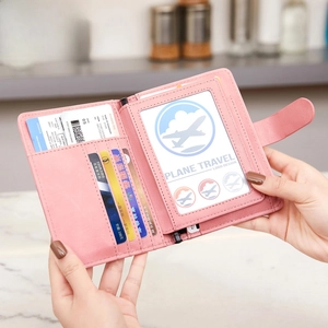 Pink RFID blocking travel passport holder with multi-card slots and secure buckle closure