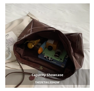 Interior view showing the large capacity of the brown tote bag with daily essentials