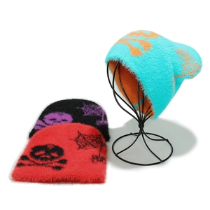 Detailed knit texture and skull spider web jacquard patterns on fuzzy beanie hats