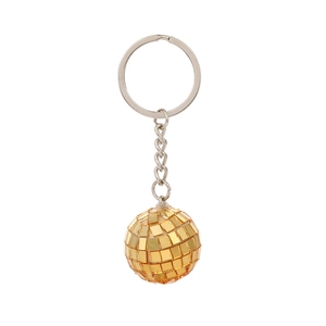 Close-up of golden disco ball keychain with reflective mirror tiles on white background