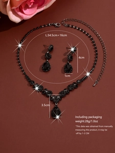 Detailed view of black crystal necklace and earrings set with dimension measurements