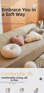 Detail of plush faux rabbit fur pillows in heart and cloud shapes on a cozy sofa