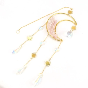 Detail of pink crystal chips in golden moon frame with aurora prism suncatcher