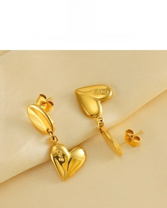 Close-up of 18K gold-plated stainless steel heart earrings with LOVE engraving