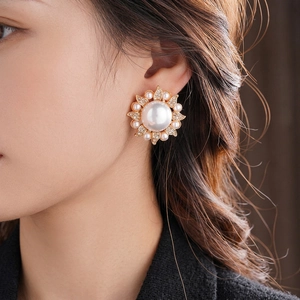 Luxe sunflower pearl stud earrings with sparkling crystals and gold finish for women