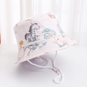Detail of pink kids sun hat with cartoon animal patterns and adjustable chin strap