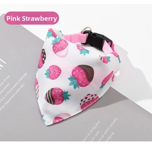 Detail of pink strawberry pet bandana with adjustable black buckle and metal D-ring
