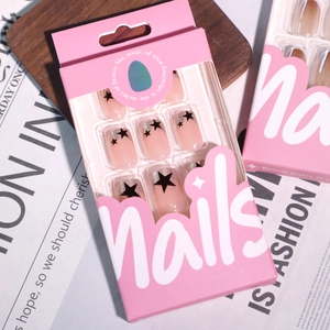 French pearlescent pink press-on nails with black stars in elegant paper gift box