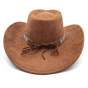 Close-up of brown suede cowboy hat with ethnic patterned band and leather drawstring