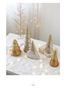 Detailed view of Morandi green and gold mini cone Christmas trees with glitter finish