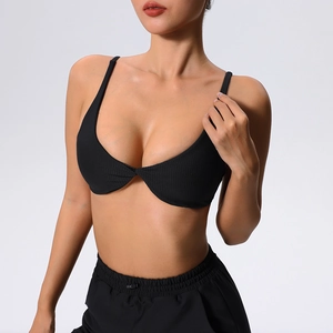 Women's black ribbed sports bra with deep V-neck and twist front detail for yoga