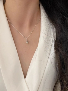 Detailed view of an S925 sterling silver waterdrop pendant on a sleek snake bone chain