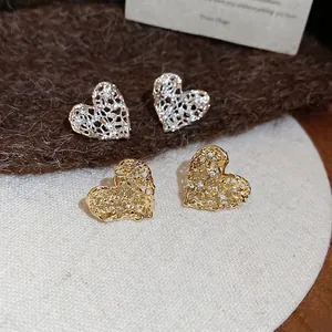 Hollow heart stud earrings with sparkling zircons in gold and silver finish for women