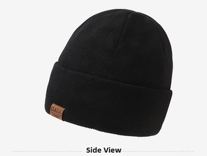 Detail shot of the black knitted beanie featuring a classic sport faux leather patch label