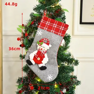 Grey burlap Christmas stocking with snowman decor and red plaid cuff, 36cm height