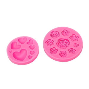 Pink silicone mold set featuring heart and rose flower shapes for DIY cake baking decoration