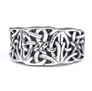 Detailed view of vintage Celtic knot engraving with oxidized silver finish on wide ring