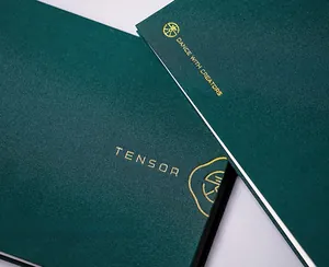 Close-up of deep green cloth nail sticker organizer with elegant gold foil stamping