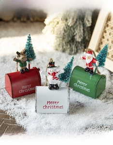 Miniature metal Christmas mailboxes with reindeer, snowman, and Santa figurines