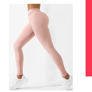 Detail of pink high-waisted seamless yoga pants with jacquard texture and lifting effect