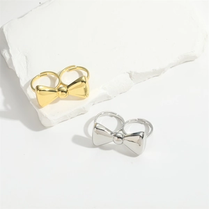 Luxury open bow rings for women in gold and silver finish, minimalist jewelry