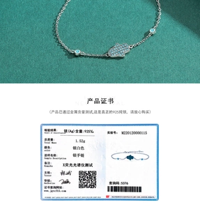Detail of 925 sterling silver Hamsa hand bracelet with blue stones and authenticity certificate