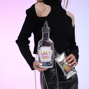 Quirky sauce bottle shaped crossbody bag with metallic silver condiment pouch charm