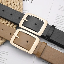Flat lay of black and khaki hollow eyelet belts with square gold-tone buckles
