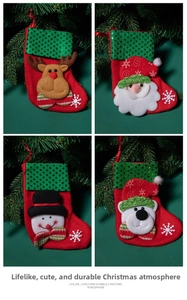 Four Christmas stockings with sequins featuring reindeer, Santa, snowman, and bear characters