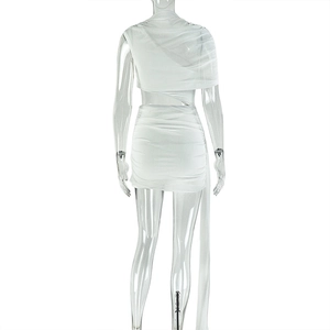 Detail view of white sheer mesh dress featuring open back and ruched asymmetric design