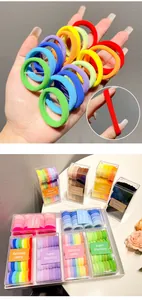 Detail showing 3cm high elasticity hair ties in colorful boxes with macro size view