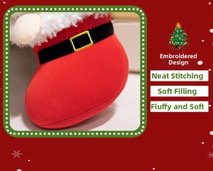 Detail of plush Santa boot with high-quality embroidery and neat stitching on red fabric