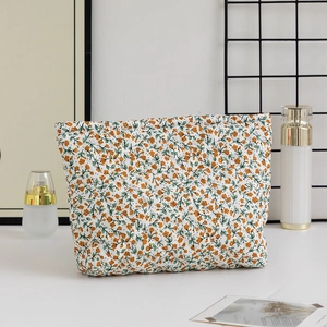 Detailed view of the diamond quilted pattern and floral print on this large cosmetic bag