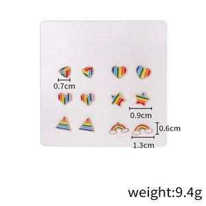 Rainbow enamel stud earrings set with heart, star, and triangle shapes on a display card