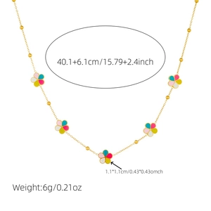 Detail view of gold chain necklace featuring five colorful enamel flower pendants