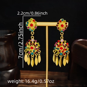 Detail shot of bohemian tassel earrings showing length and width dimensions on a stand