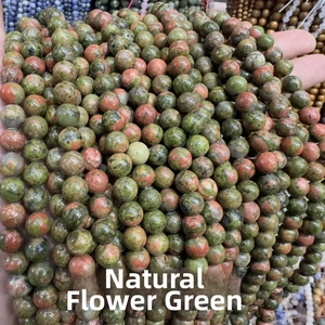 Close-up of natural unakite round loose beads for DIY jewelry making in bulk
