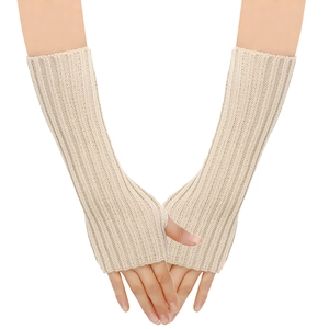 Detail view of beige knitted fingerless gloves with vertical ribbed texture and arm length