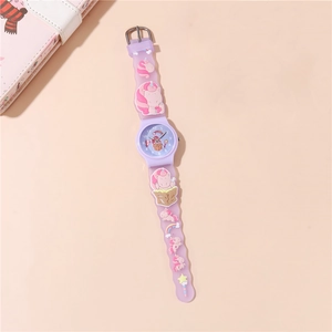 Close-up of kids quartz watch with 3D unicorn and rainbow designs on purple silicone strap
