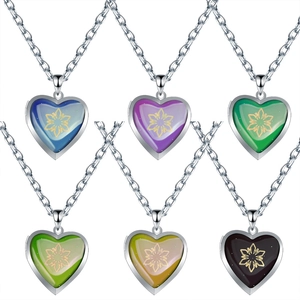Detail showing heart locket necklaces with snowflake patterns in six temperature-changing colors