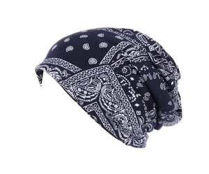 Macro shot of paisley pattern on a navy blue soft cotton slouchy beanie cap