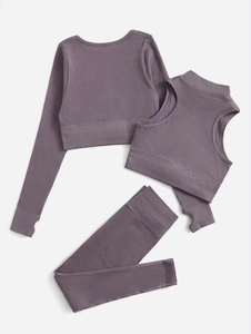 Detailed flat lay of three-piece grey-purple ribbed seamless yoga set with thumbhole sleeves