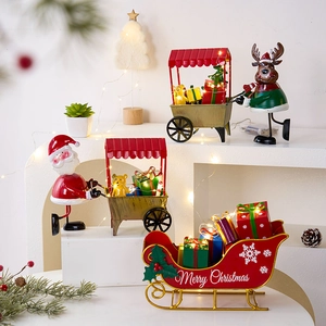 Christmas train tabletop decor with Santa, reindeer and LED lights on white display stand