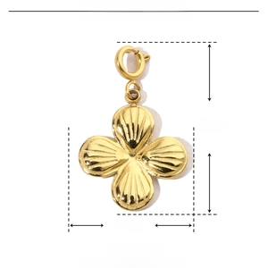 Macro shot of gold four-leaf clover pendant with 25mm by 15mm size dimensions