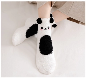 Close-up of thick coral fleece winter socks with 3D panda ears and cute cartoon embroidery