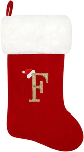 Detail of red velvet Christmas stocking with white plush cuff and gold embroidered letter F