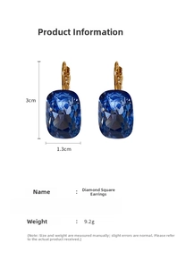 Detail view of blue square-cut rhinestone earrings with gold plating and size labels